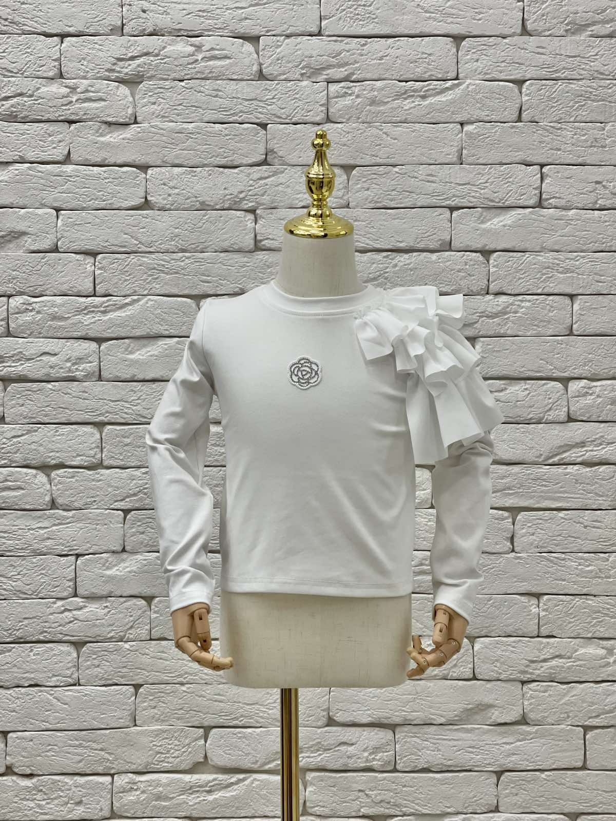 Светри. Гольф для дівчинки молочний 823379